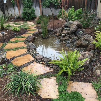 custom water feature by landscape solutions