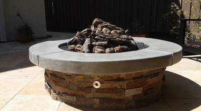 custom outdoor stone firepit by landscape solutions