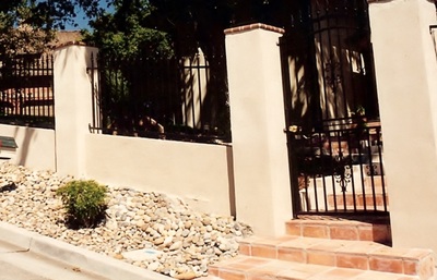 Retainer Wall with rod iron fence