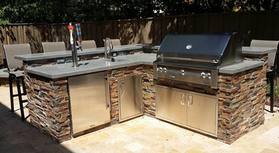 custom outdoor bbq, sink, fridge and tap by landscape solutions
