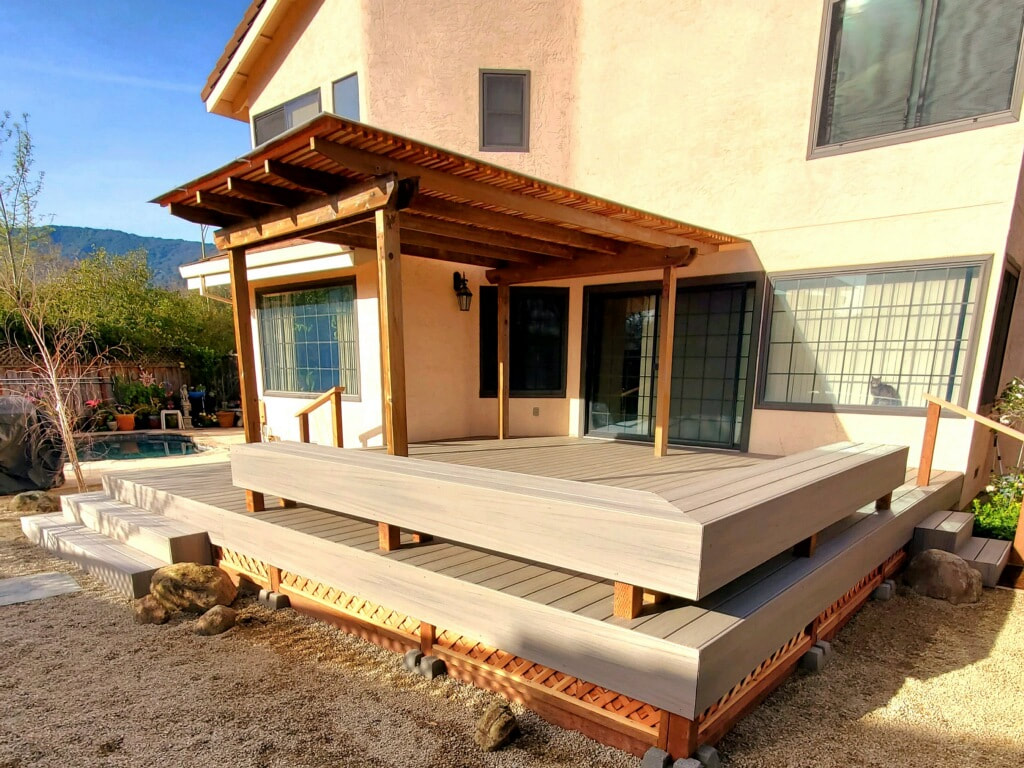 new backyard landscaping including new Trex deck with wrap around benching and steps, pergola, 
Cal-gold gravel, boulders, flagstone, planting, 